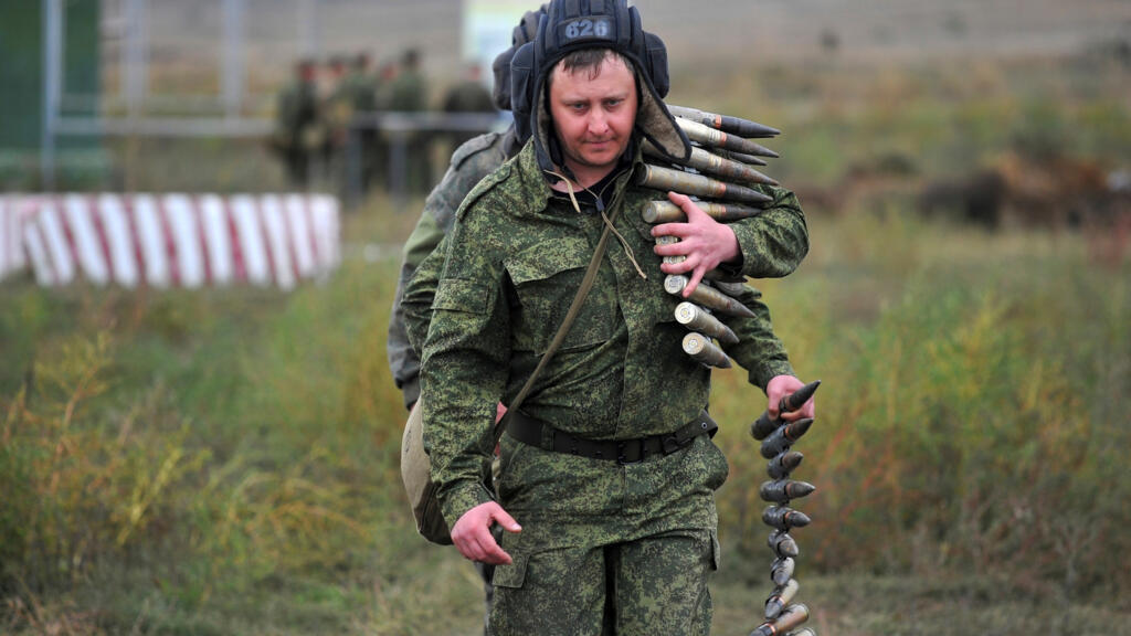 Recruits carry ammunition during training at a firing range in the Rostov-on-Don region of southern Russia on October 4, 2022