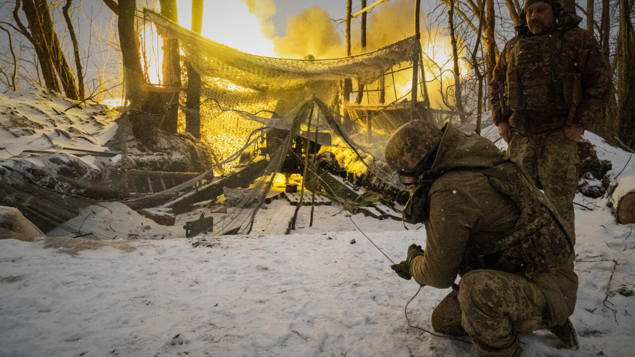 Ukrainian soldiers fire at Russian positions on the front line in the Kharkiv region.