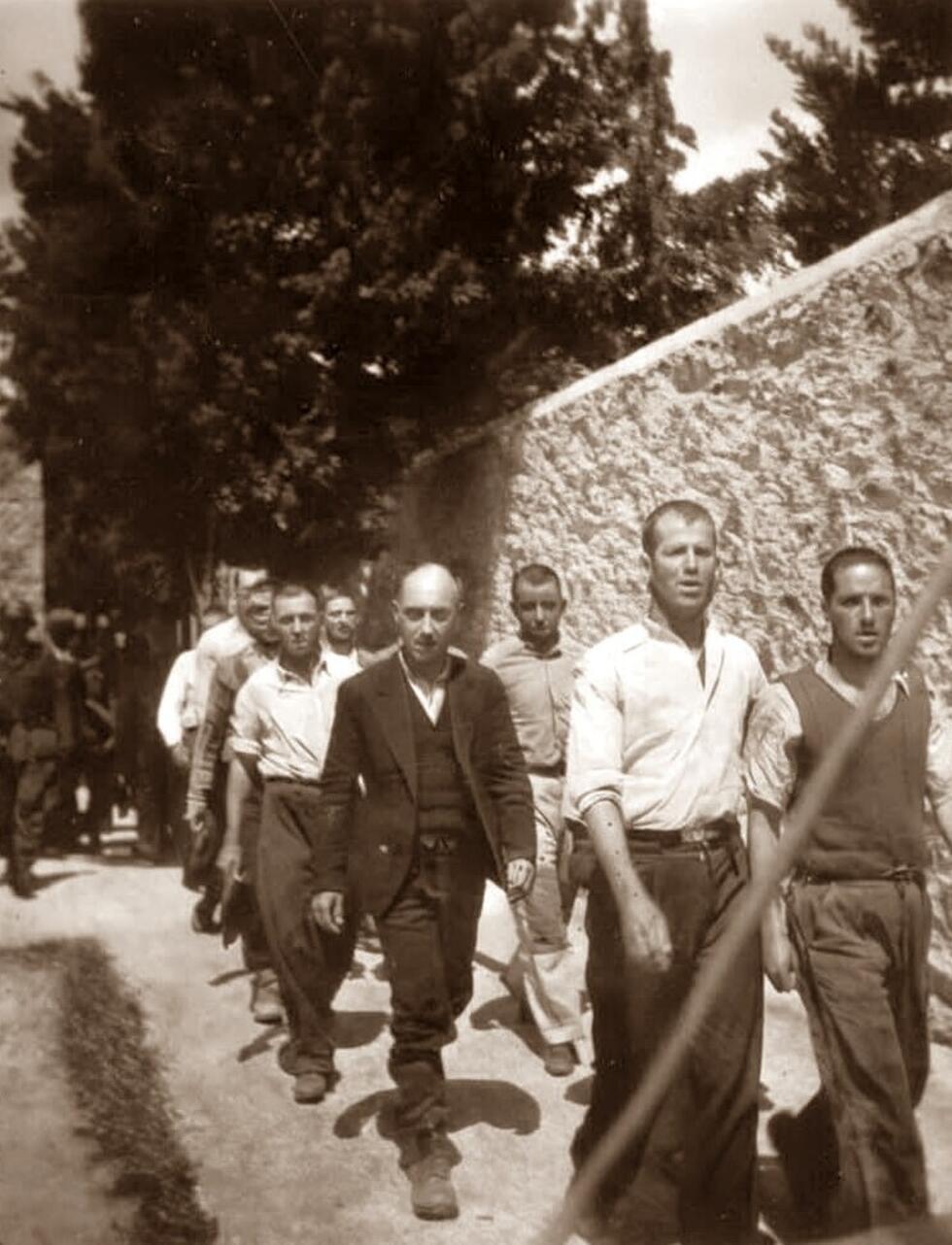 The resistance fighters sing as they walk to their death in Kaisariani, Greece, on May 1, 1944