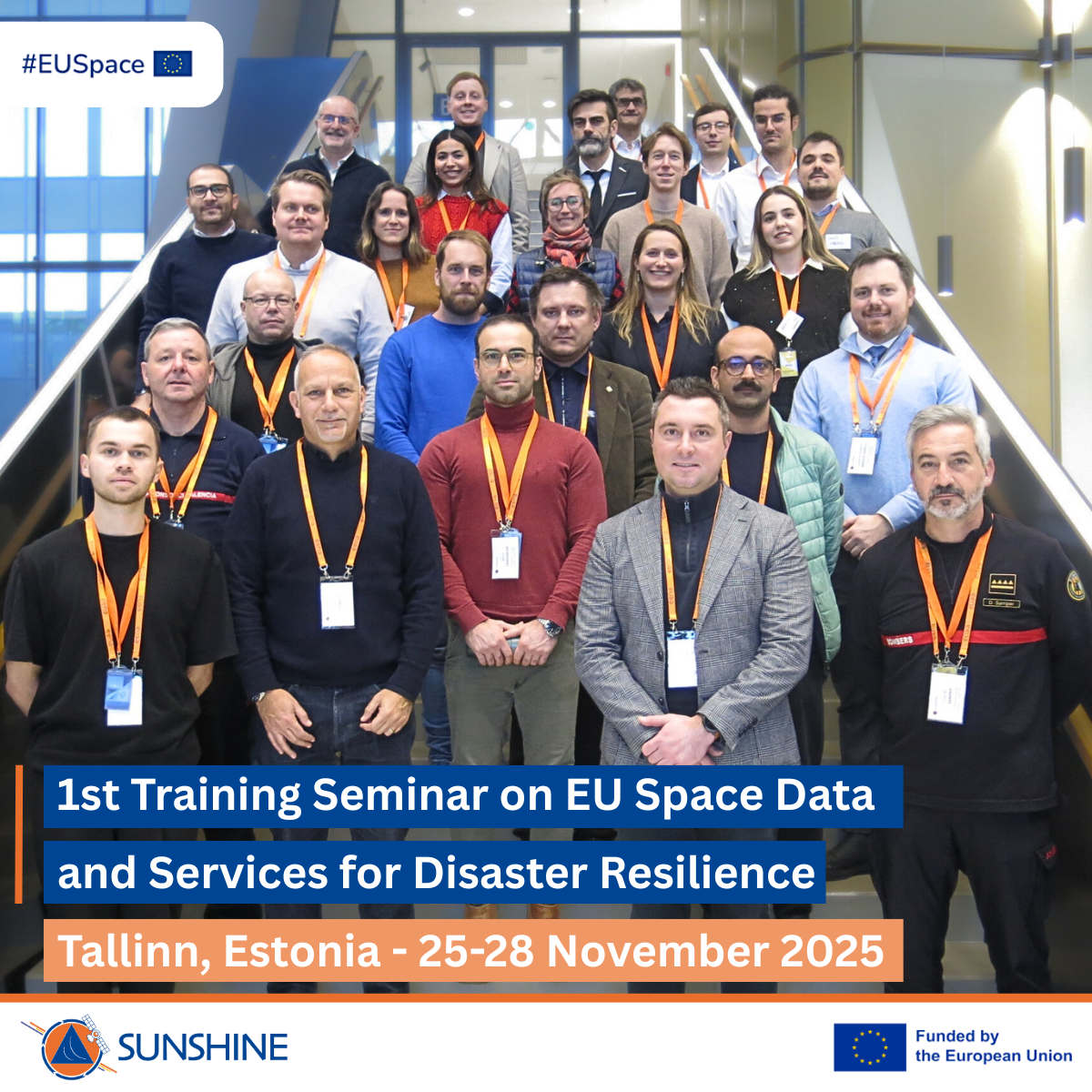 Group photo of approximately 30 participants wearing conference badges and orange lanyards, standing on indoor stairs. A banner reads: ‘1st Training Seminar on EU Space Data and Services for Disaster Resilience, Tallinn, Estonia – 25–28 November 2025.’ Logos for EU Space, Sunshine, and the European Union appear on the image.