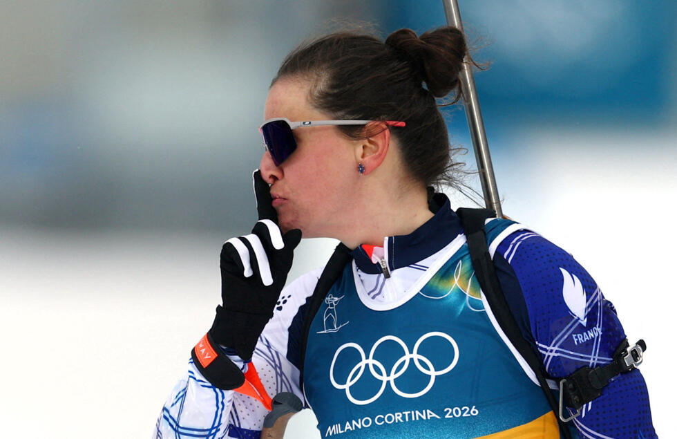 Julia Simon of France reacts after crossing the finish line at the Anterselva Biathlon Arena in South Tyrol, Italy on February 11, 2026