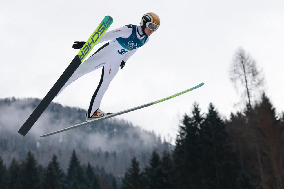 Thomas Rettenegger of Austria in action during the ski jumping competition at Predazzo Ski Jumping Stadium in Italy on February 11, 2026