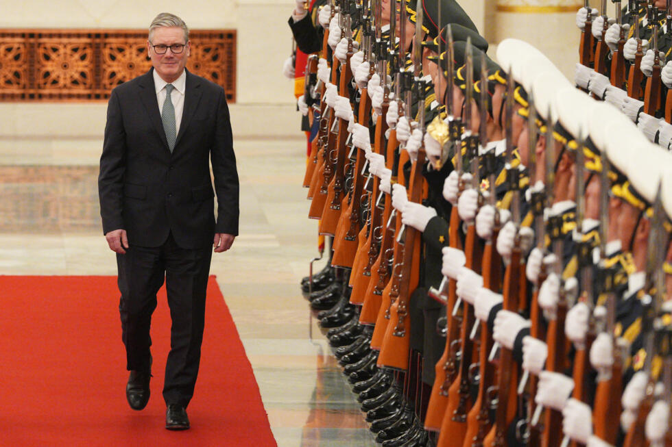 Britain's Prime Minister Keir Starmer inspects a Chinese honour guard with Chinese Premier Li Qiang (not pictured) during a welcome ceremony at the Great Hall of the People in Beijing.