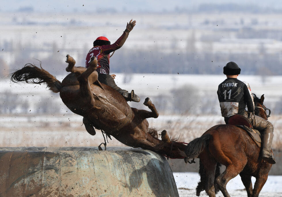 Kyrgyz horse riders play the traditional Central Asian sport of "Kok-Boru" (Gray Wolf) or "Buzkashi" (Goat Grabbing) in the settlement of Don-Aryk, some 80km from Bishkek.