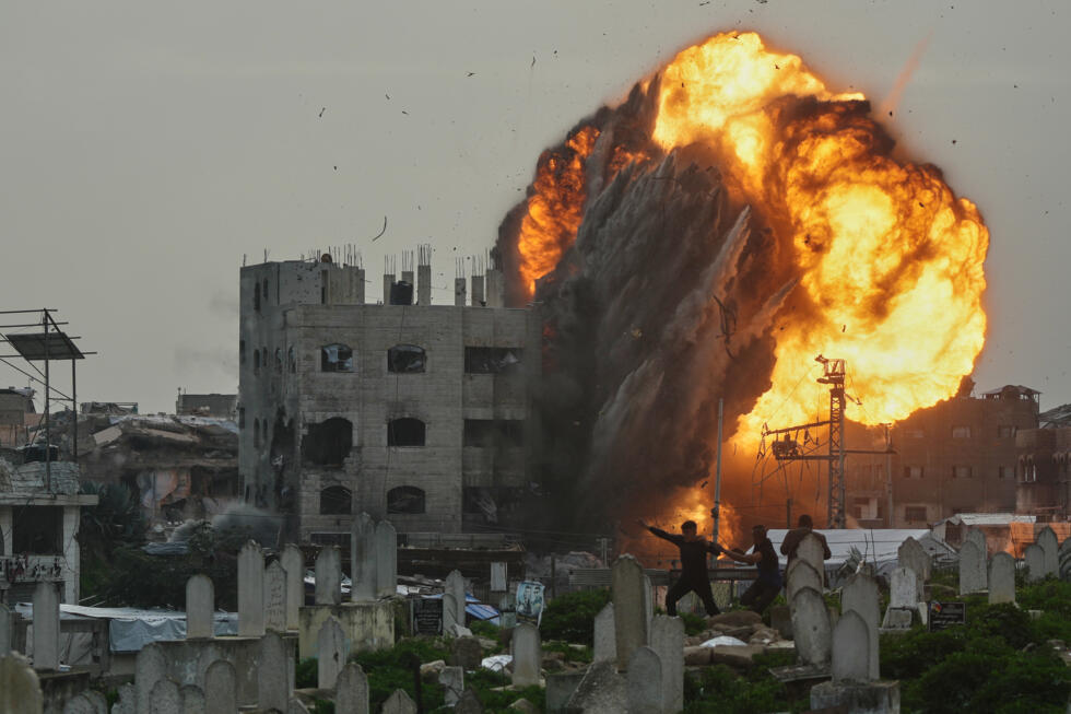 Smoke and flames rise from an Israeli military strike on a building in the Zeitoun neighbourhood of Gaza City.