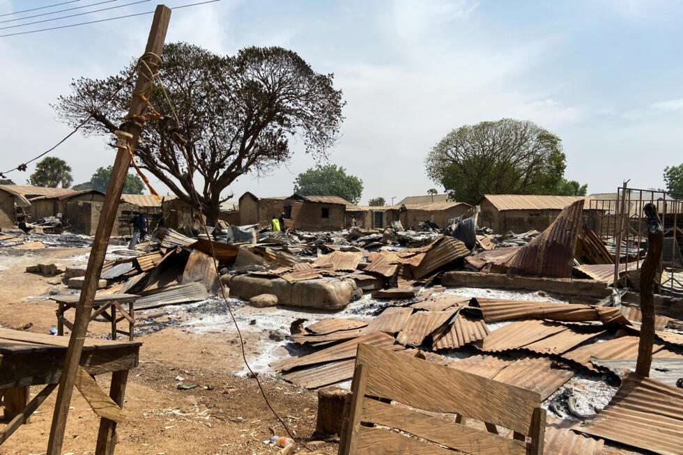 Homes and market stalls that were burned in an Islamist attack in the village of Woro, Nigeria.