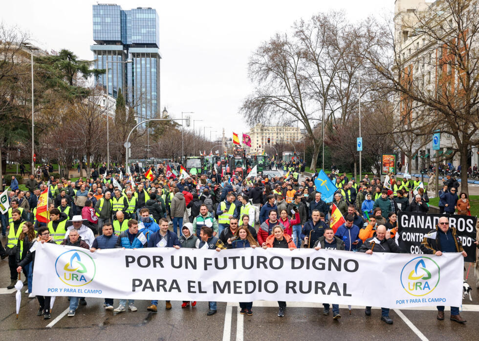 Demonstrators carry a banner during a protest following the EU-Mercosur trade deal, in Madrid, Spain on February 11, 2026