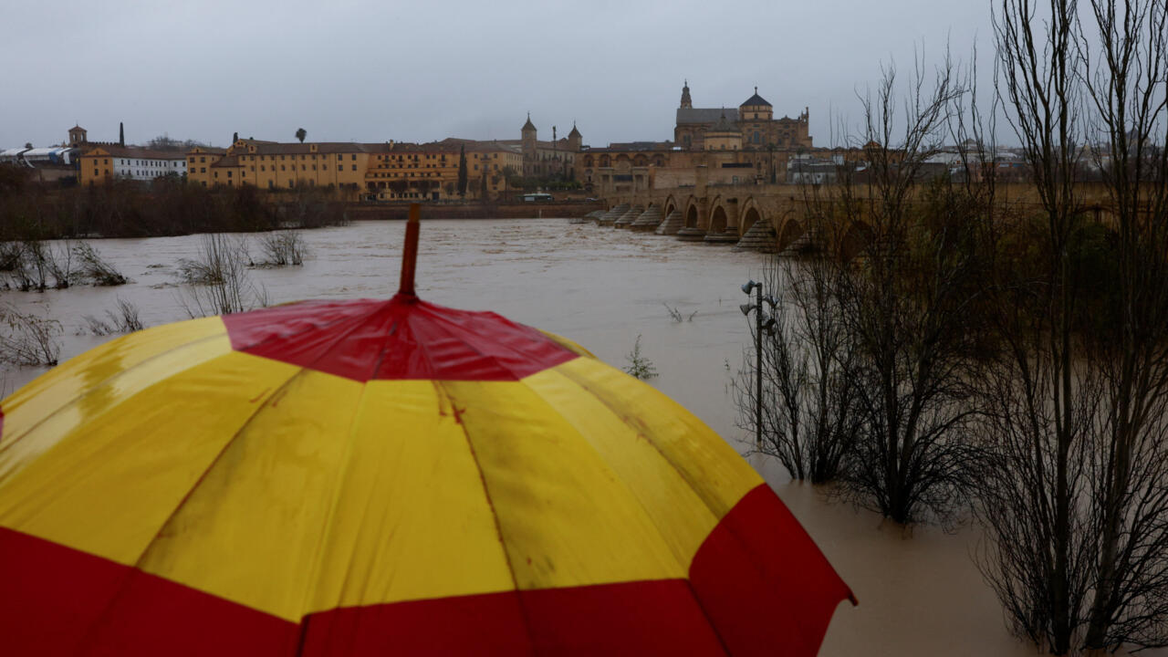 A boat-shaped jungle gym is surrounded by water at a flooded children