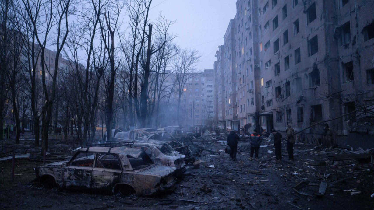 Damaged cars are seen in the courtyard of a residential neighbourhood following Russia