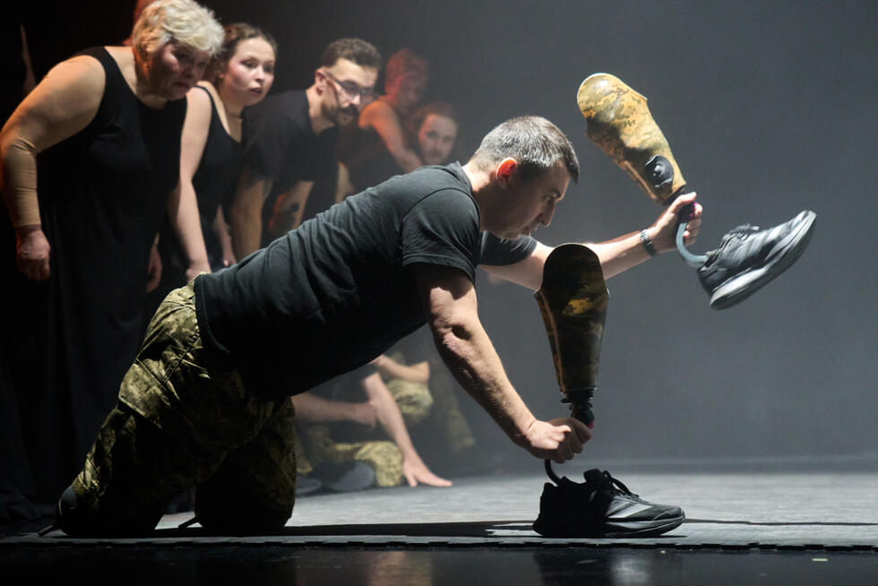 Artem Moroz, who sustained severe injuries in combat during Russia's full-scale invasion in Ukraine, performs during the play premiere in Kyiv, Ukraine, Thursday, Feb. 19, 2026