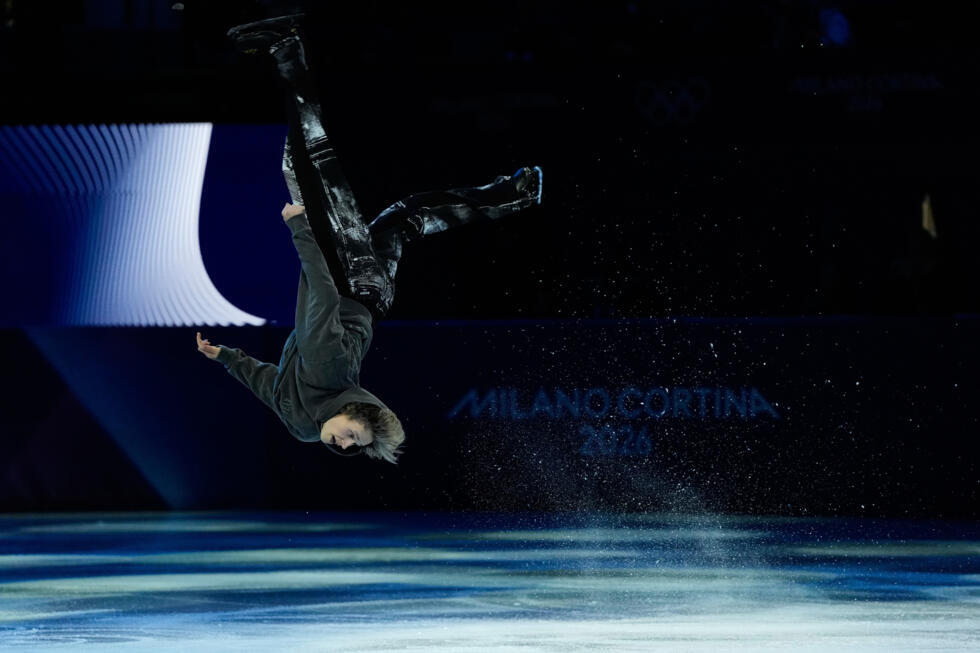 US figure skater Ilia Malinin does a back flip during his performance at the 2026 Winter Olympics, in Milan, Italy, Saturday, February 21, 2026