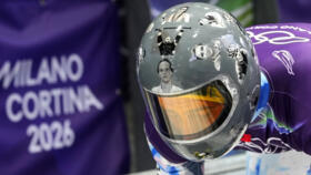 Ukraine's Vladyslav Heraskevych arrives at the finish during a men's skeleton training session at the 2026 Winter Olympics, in Cortina d'Ampezzo, Italy, Tuesday, Feb. 10, 2026.