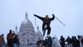 Parisians took to their skis in Montmartre and at other Paris landmarks as heavy snow blanketed the French capital.