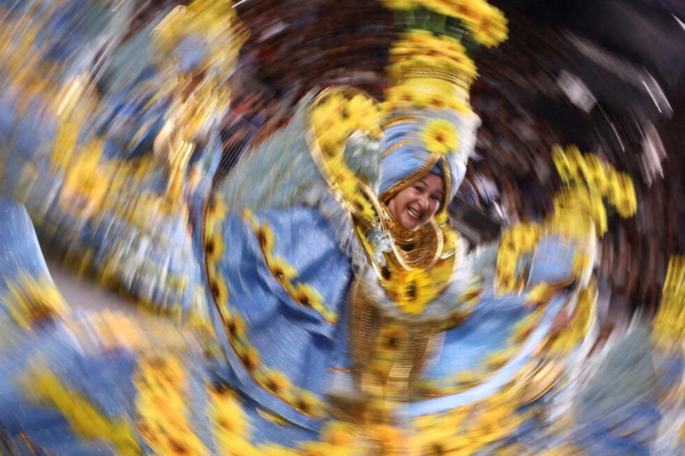 Revellers from Aguia de Ouro school perform during the Carnival parade at Anhembi Sambadrome in Sao Paulo, Brazil.