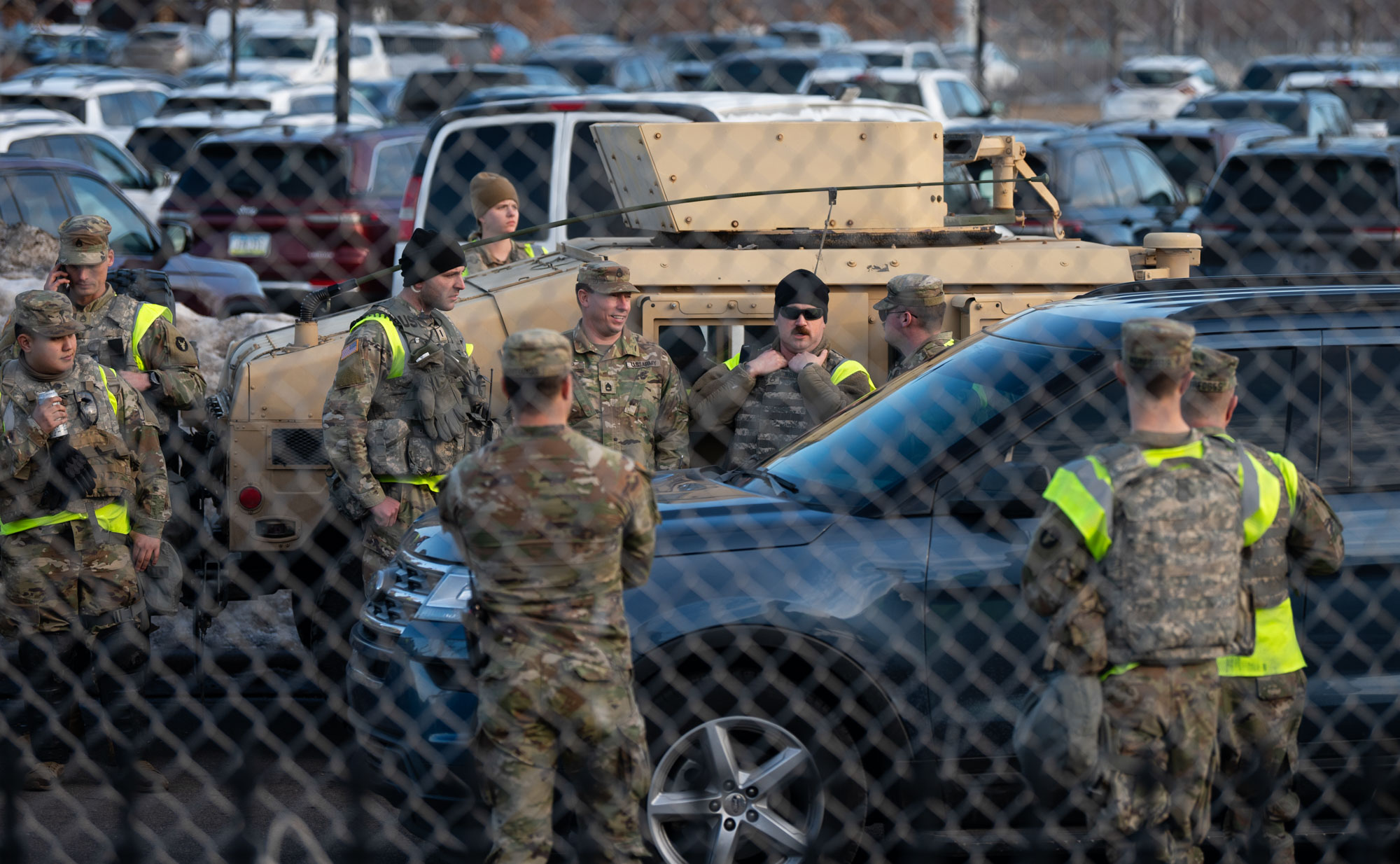 Members of the Minnesota National Guard stage in the parking lot outside the Bishop Henry Whipple federal building on February 13, 2026 in Minneapolis, Minnesota. 