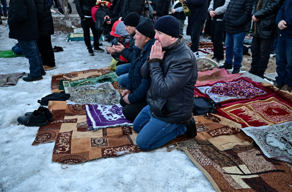 Muslim worshippers attend Eid al-Fitr prayers, marking the end of the holy fasting month of Ramadan, outside a mosque on a frosty morning in the Siberian city of Krasnoyarsk.