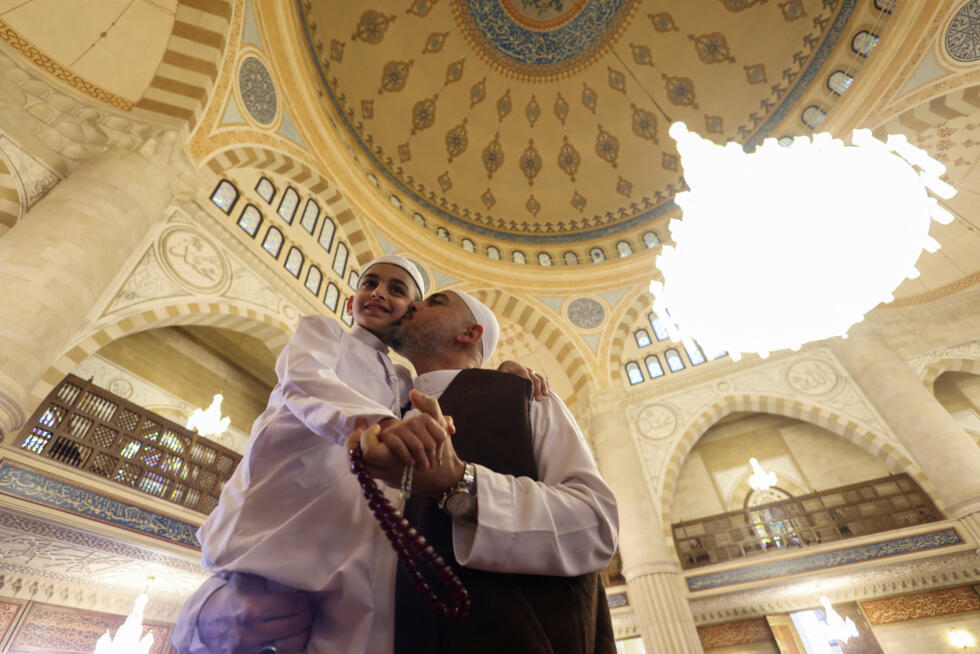 Muslim worshippers gather at the Hajj Bahaa El-Din al-Hariri Mosque Complex on the day of attending Eid al-Fitr prayers to mark the end of the holy fasting month of Ramadan in Sidon, Lebanon.