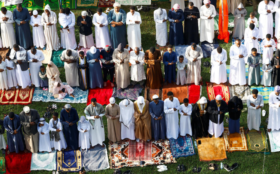 Muslim faithful attend Eid al-Fitr prayers, marking the end of the fasting month of Ramadan, at the Sir Ali Muslim Club Ground in Ngara district of Nairobi, Kenya.