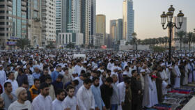 Muslim worshippers attend mass Eid al-Fitr prayers marking the end of the holy fasting month of Ramadan in Dubai, United Arab Emirates, Sunday, March 30, 2025. 