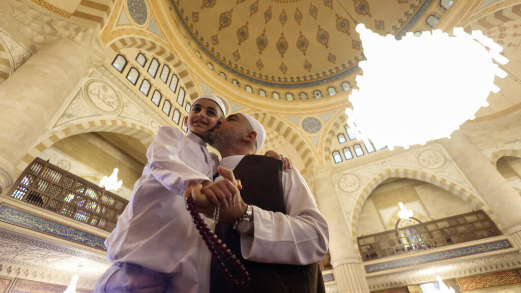Muslim worshippers gather at the Hajj Bahaa El-Din al-Hariri Mosque Complex on the day of attending Eid al-Fitr prayers to mark the end of the holy fasting month of Ramadan in Sidon, Lebanon.