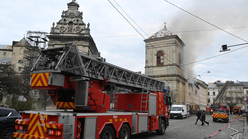 Smoke rises from a burning building following a Russian drone attack in Lviv on March 24, 2026