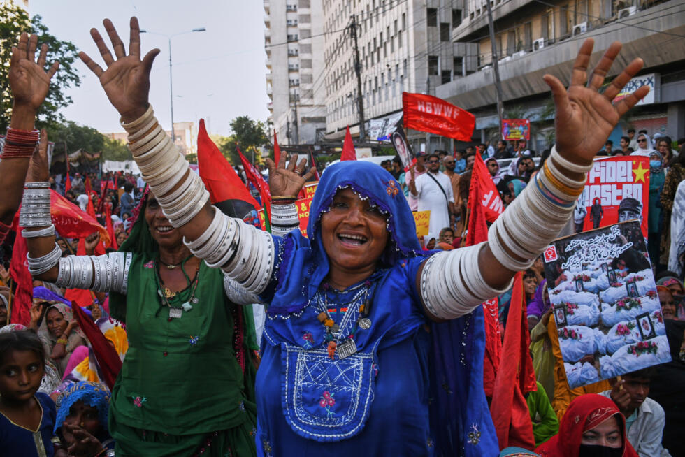 Women's right activists take part in a rally to mark International Women's Day, in Karachi, Pakistan, Sunday, March 8, 2026.