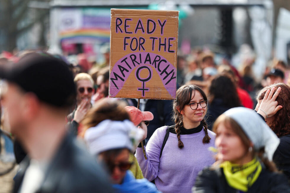 A woman holds a sign during a demonstration under the motto "feminist, in solidarity, unionised" to mark International Women's Day in Berlin, Germany, March 8, 2026.