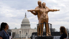 Protest art representing President Donald Trump and Jeffrey Epstein near the US Capitol on March 11, 2026.