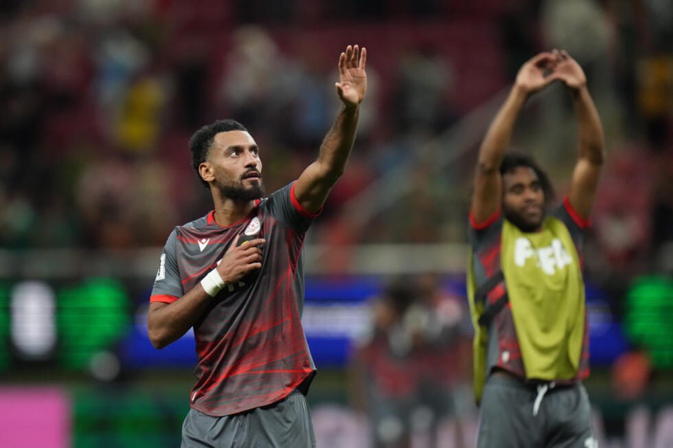 New Caledonia's players greet fans after a World Cup playoff semifinal soccer match between New Caledonia and Jamaica in Guadalajara, Mexico.