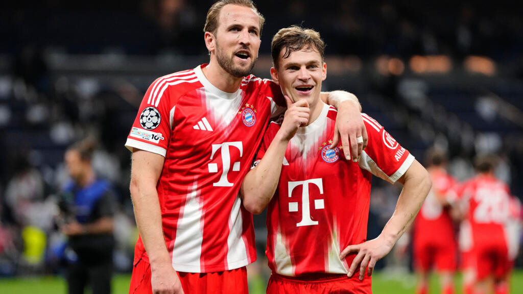 Bayern's Harry Kane, left, and teammate Joshua Kimmich look at the fans after the first leg of the Champions League quarter-final football match between Real Madrid and Bayern Munich in Madrid, Spain