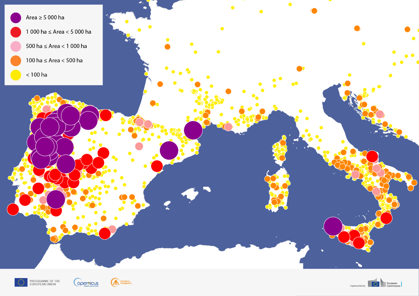 A map showing the distribution and size of fires recorded in 2025. Each fire is represented by a colour-coded circle indicating burnt area: yellow for fires under 100 hectares, orange for 100 to 500 hectares, pink for 500 to 1,000 hectares, red for 1,000 to 5,000 hectares, and purple for fires exceeding 5,000 hectares. The Iberian Peninsula, and particularly its northwestern region, shows the highest concentration of large and very large fires, with numerous purple and red circles clustered across Spain and Portugal. Smaller fires are more widely distributed across southern France, Italy, and the broader Mediterranean basin.