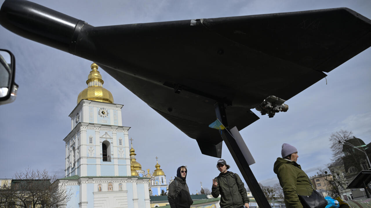 Ukraine soldiers at the funeral of a child killed in a Russian drone attack on a multi-storey residential building in Odesa.