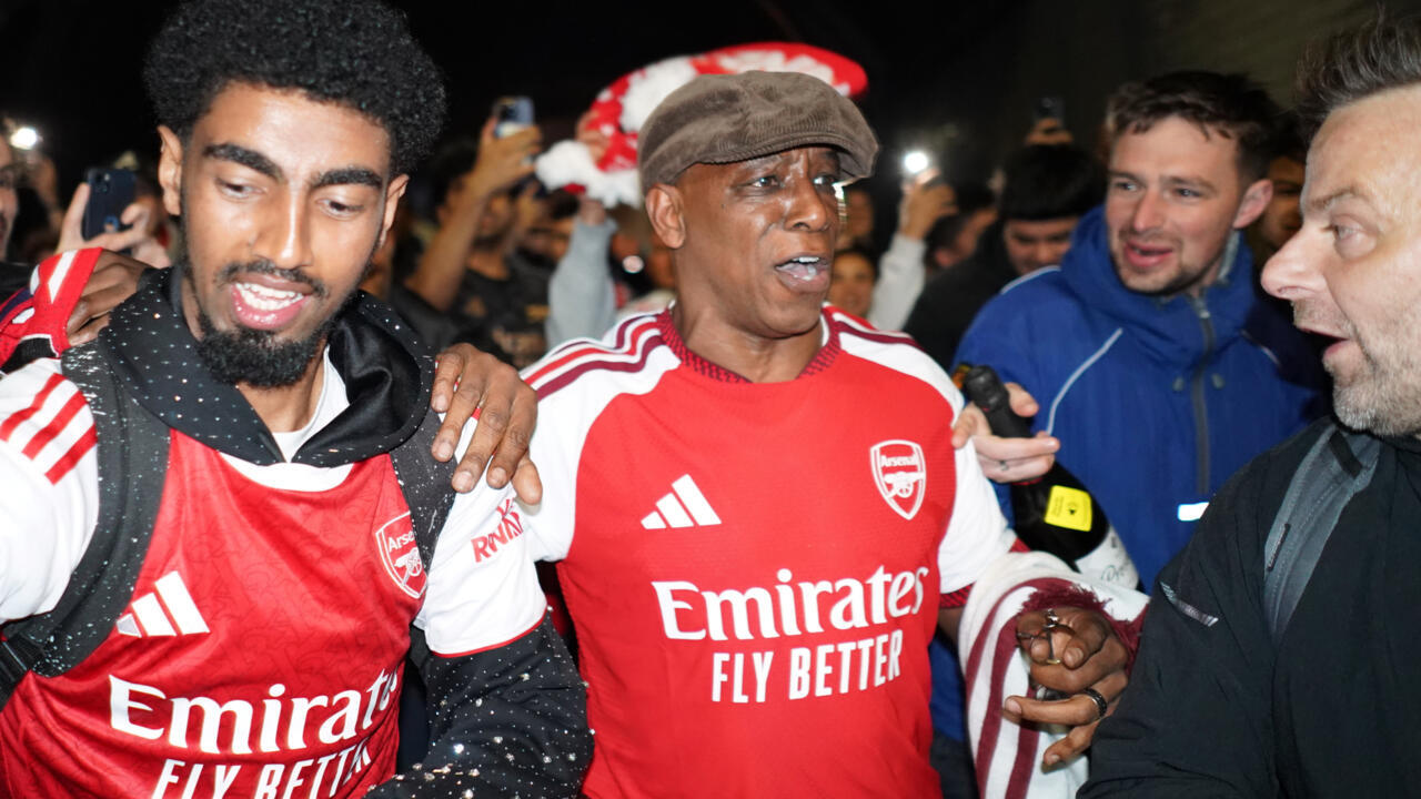 Former Arsenal player Ian Wright arrives at the Arsenal stadium to celebrate with supporters after Arsenal