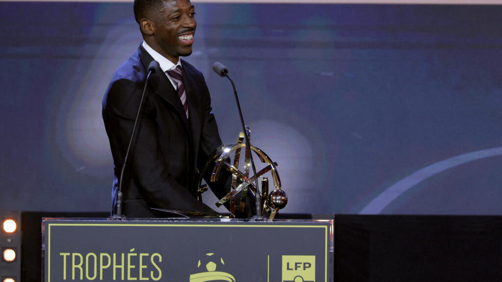Paris Saint-Germain's French forward #10 Ousmane Dembele receives the Ligue 1 best player award during the 34th UNFP's (France's professional players union) French football awards ceremony in Paris on May 11, 2026.