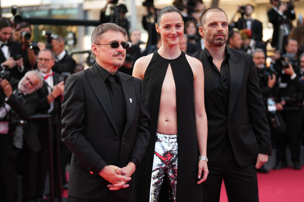 From left: Cristian Mungiu, Renate Reinsve and Sebastian Stan pose for photographers upon arrival at the awards ceremony during the 79th international film festival, Cannes, southern France