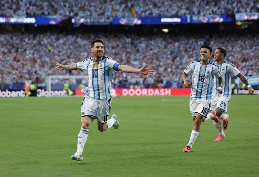 Argentina's Lionel Messi celebrates scoring their first goal.