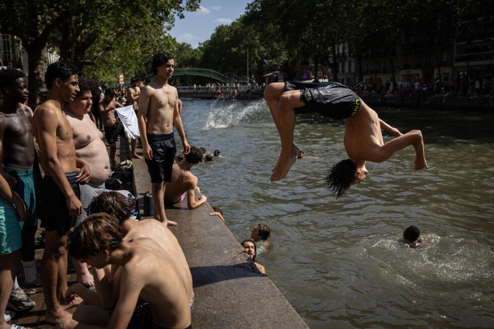 Paris authorities have opened up the Canal Saint-Martin for swimming to help people cool off