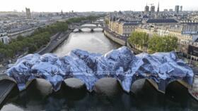 An aerial view of "The Pont Neuf cave" installation by French photographer and street artist JR, on the Pont-Neuf bridge in Paris, on June 1, 2026
